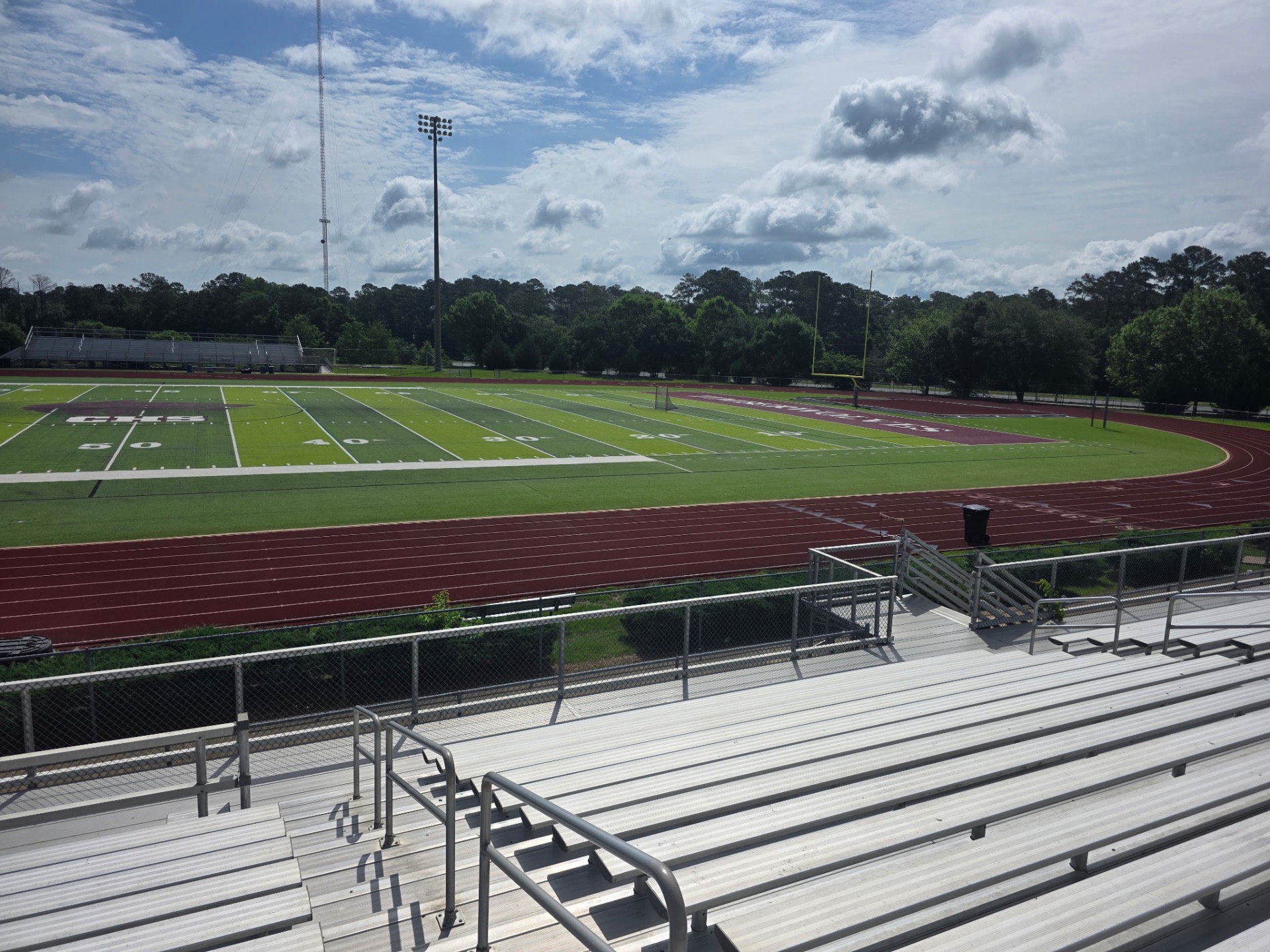 End-zone view of the field and visitor bleachers